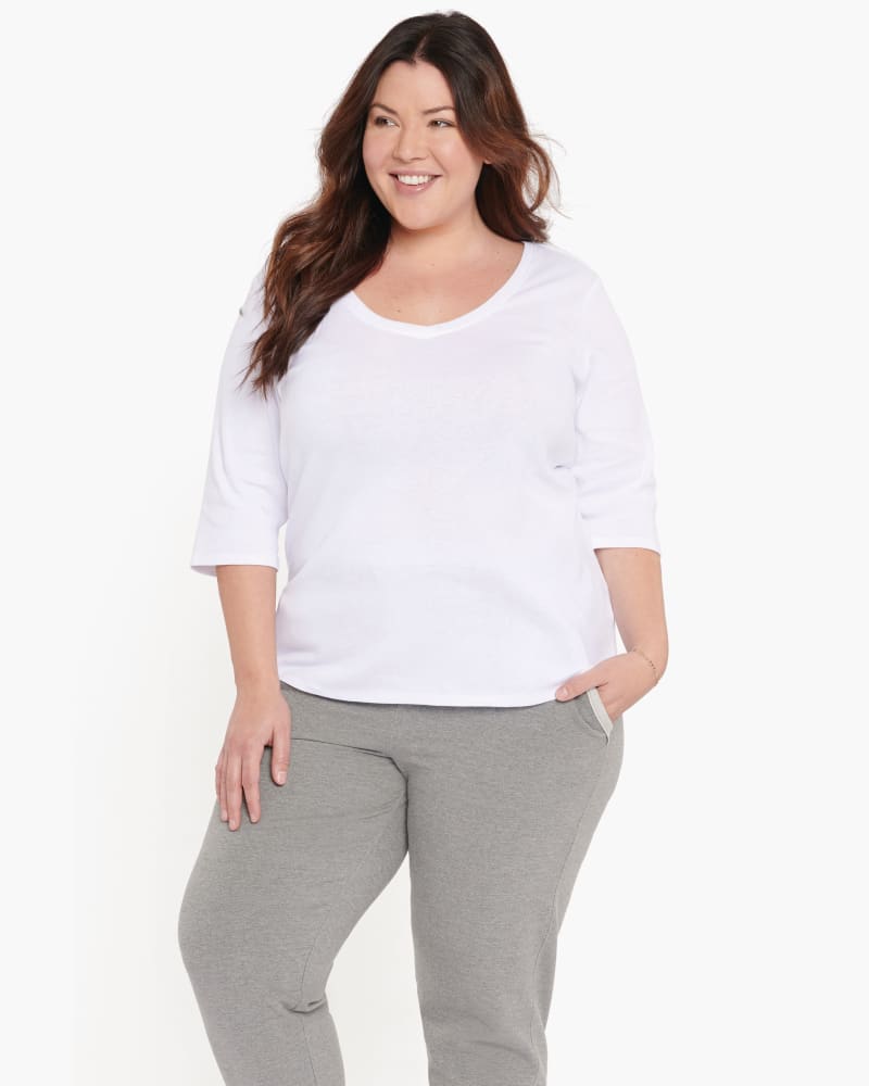 Front of a model wearing a size 0X Carrie Ribbed V-Neck Tee in Optic White by NYDJ. | dia_product_style_image_id:166448